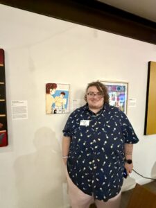 Hoagie Jay stands in front of their piece, One Day.