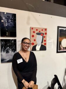 Cazoshay Marie standing in front of her piece, Mariliza in Grey.