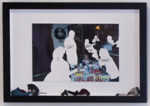 Framed print scraps of a family sitting around a table, but the people are missing.