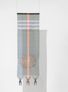 A tapestry of woven fishing line and fishing sinkers.