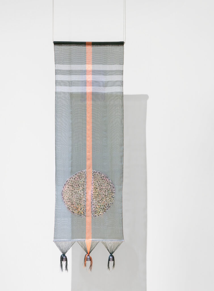 A tapestry of woven fishing line and fishing sinkers.